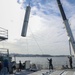 Sailors aboard the USS Howard conduct an ammo offload in Yokosuka, Japan