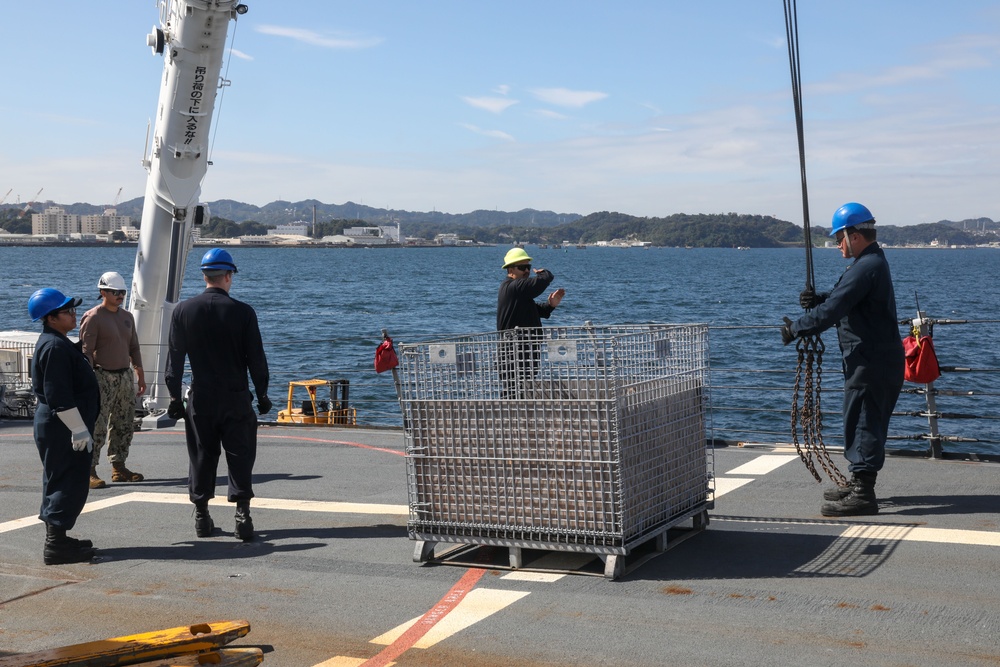 Sailors aboard the USS Howard conduct an ammo offload in Yokosuka, Japan