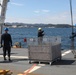 Sailors aboard the USS Howard conduct an ammo offload in Yokosuka, Japan