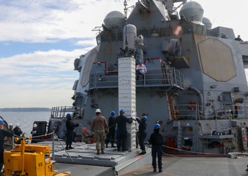 Sailors aboard the USS Howard conduct an ammo offload in Yokosuka, Japan