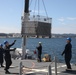 Sailors aboard the USS Howard conduct an ammo offload in Yokosuka, Japan