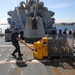 Sailors aboard the USS Howard conduct an ammo offload in Yokosuka, Japan