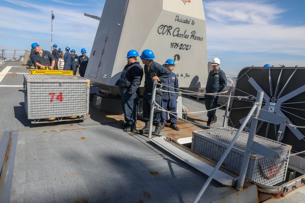 Sailors aboard the USS Howard conduct an ammo offload in Yokosuka, Japan