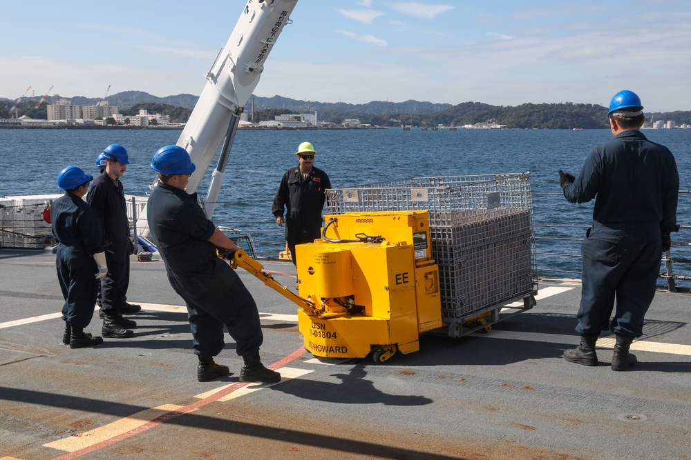 Sailors aboard the USS Howard conduct an ammo offload in Yokosuka, Japan