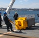 Sailors aboard the USS Howard conduct an ammo offload in Yokosuka, Japan