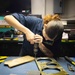 Sailors fabricate a metal patch aboard USS George Washington