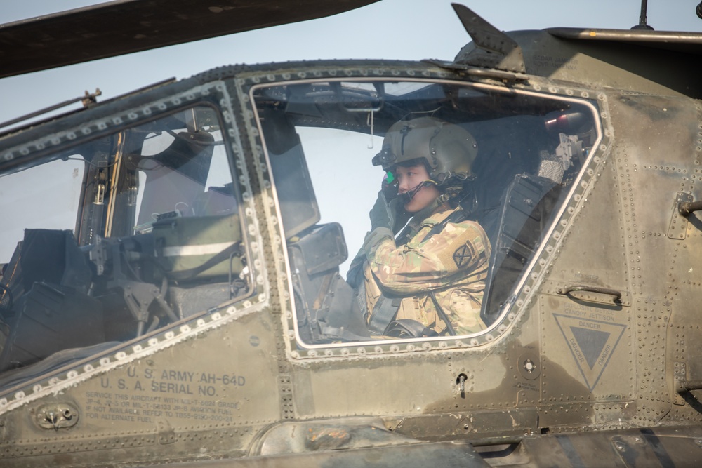 A Pilot Adjusts Their Helmet Display