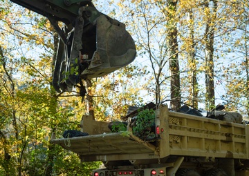 Tennessee Army National Guardsmen clear debris on Hartford Road in Cocke County, Tennessee