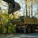 Tennessee Army National Guardsmen clear debris on Hartford Road in Cocke County, Tennessee