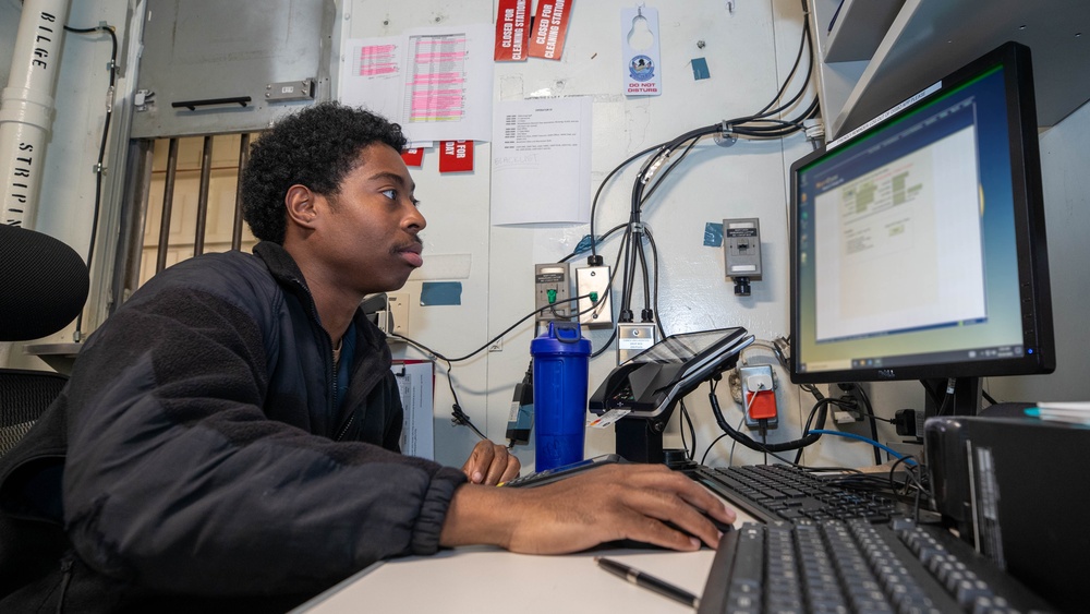 USS George Washington Sailors manage transactions