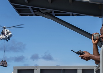 USS George Washington conducts replenishment-at-sea with USNS Cesar Chavez