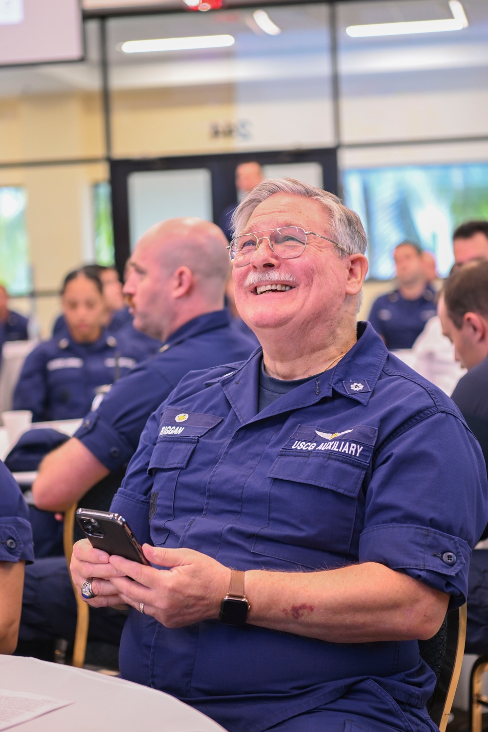 Commandant and Master Chief Petty Officer of the Coast Guard discuss service culture with crews in the greater Miami area