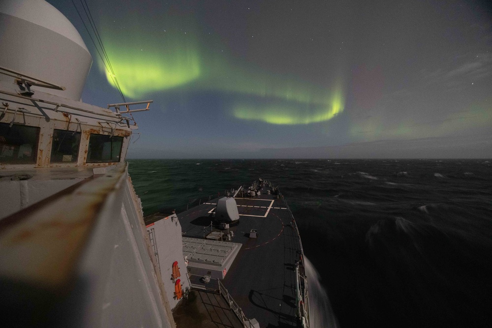 USS Stout Sails Under Northern Lights