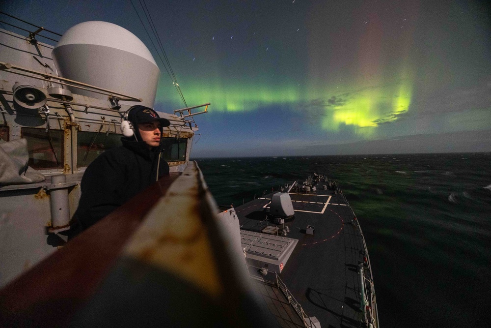 USS Stout Sails Under Northern Lights