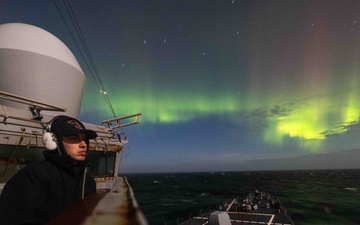 USS Stout Sails Under Northern Lights