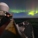 USS Stout Sails Under Northern Lights