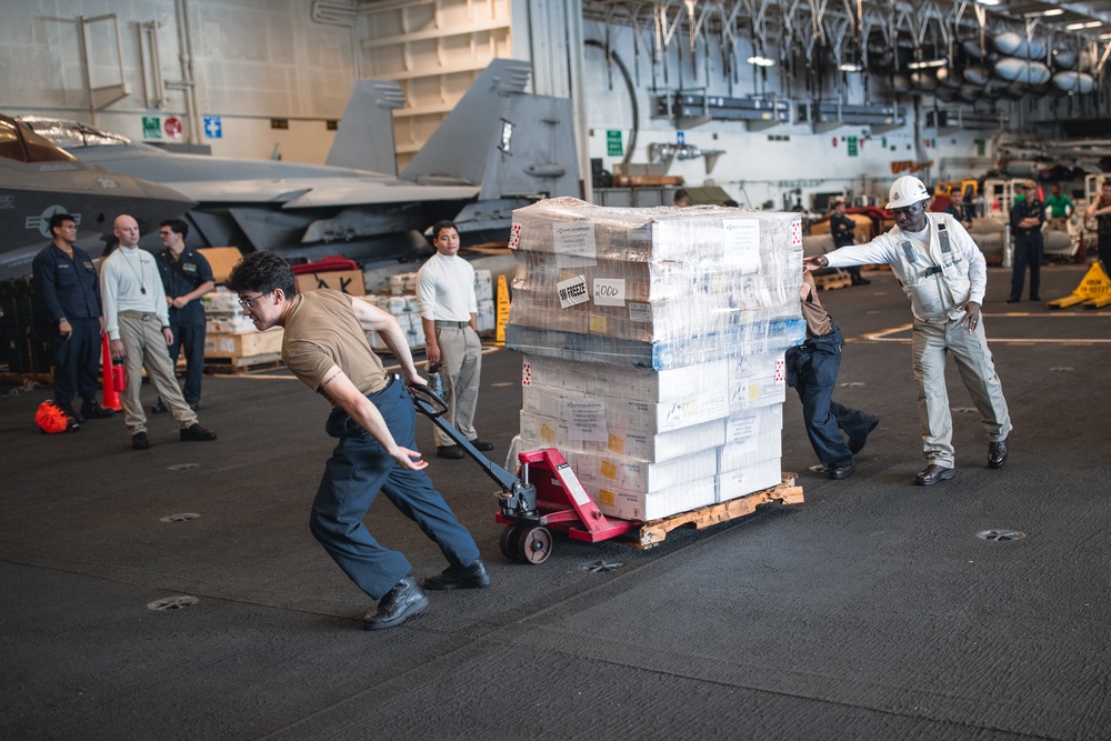 USS George Washington conducts replenishment-at-sea with USNS Cesar Chavez
