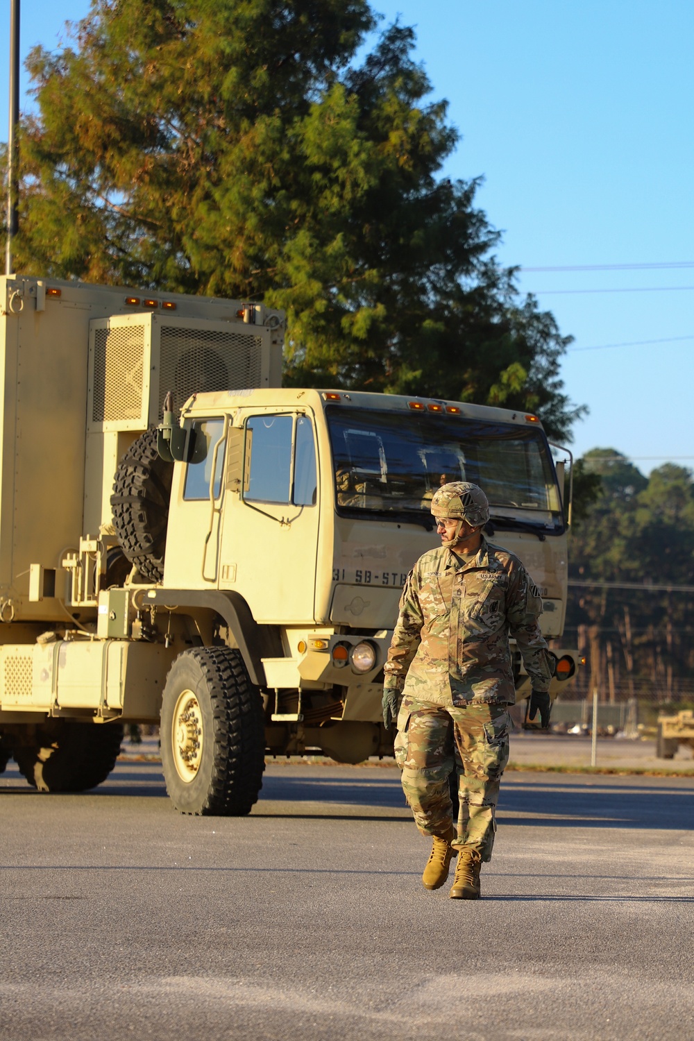 Sustainment Soldiers Conduct preventative maintenance check on M1087 Expandable Van Shelter