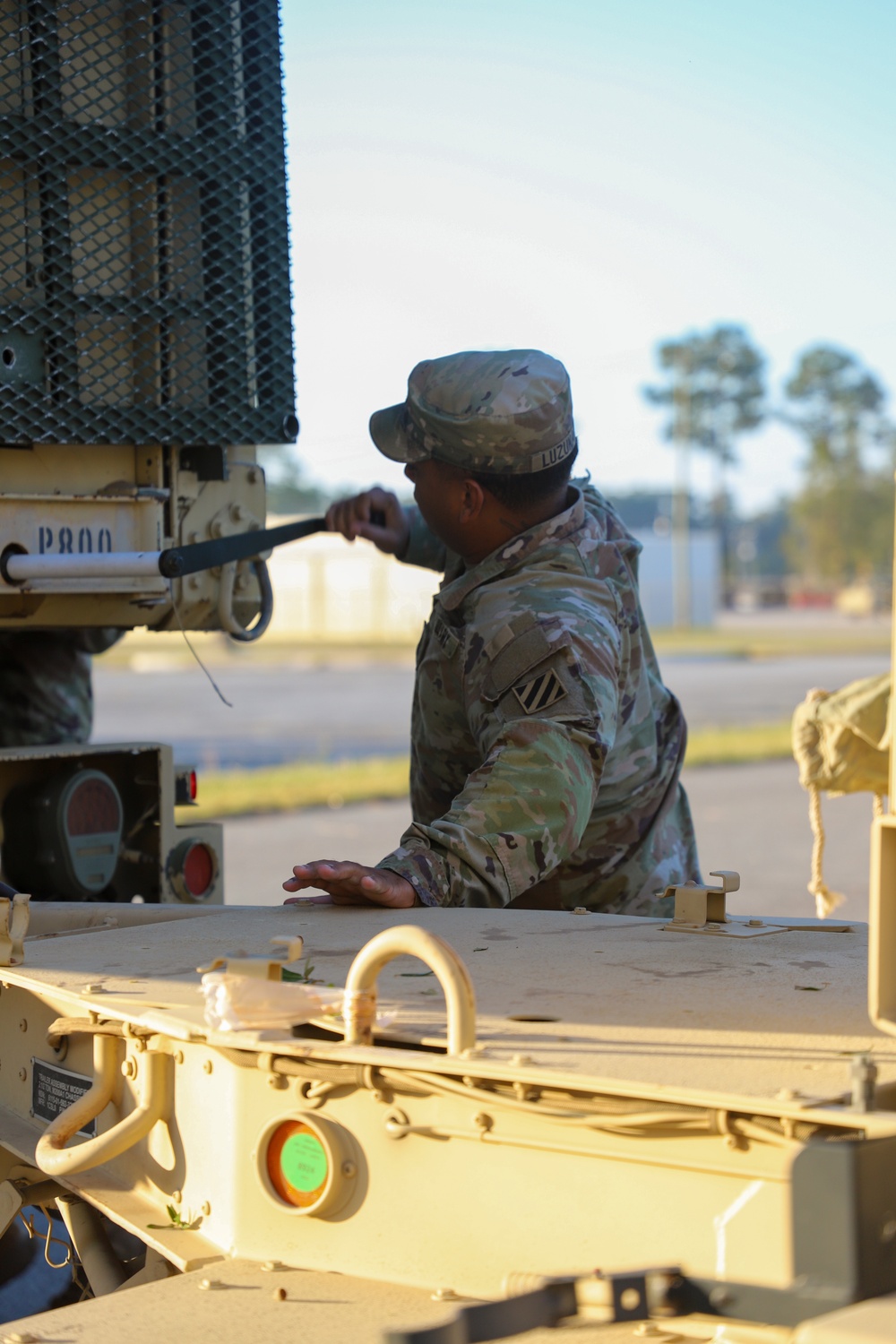 Sustainment Soldiers Conduct preventative maintenance check on M1087 Expandable Van Shelter