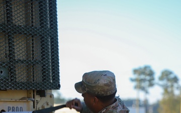 Sustainment Soldiers Conduct preventative maintenance check on M1087 Expandable Van Shelter