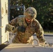 Sustainment Soldiers Conduct preventative maintenance check on M1087 Expandable Van Shelter