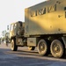 Sustainment Soldiers Conduct preventative maintenance check on M1087 Expandable Van Shelter