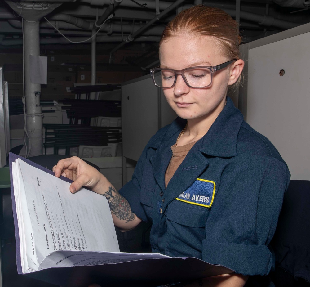 USS George Washington Sailors Review Travel Claims and Qualifications