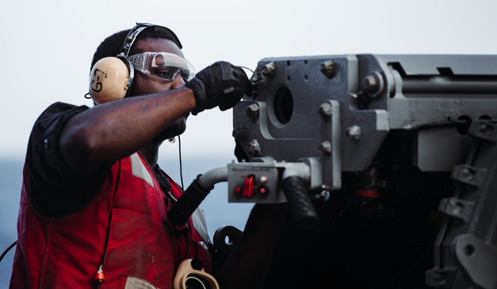 USS Ronald Reagan (CVN 76) fires Mk-38 machine gun