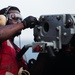 USS Ronald Reagan (CVN 76) fires Mk-38 machine gun