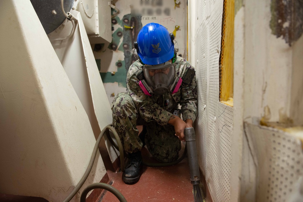 Sailor perfoms deck work