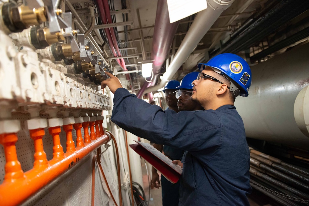 Sailors check air control valves