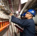 Sailors check air control valves
