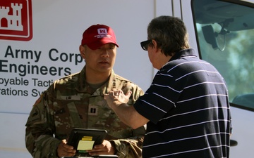 CPT. John Lim assists homeowner with blue roof application