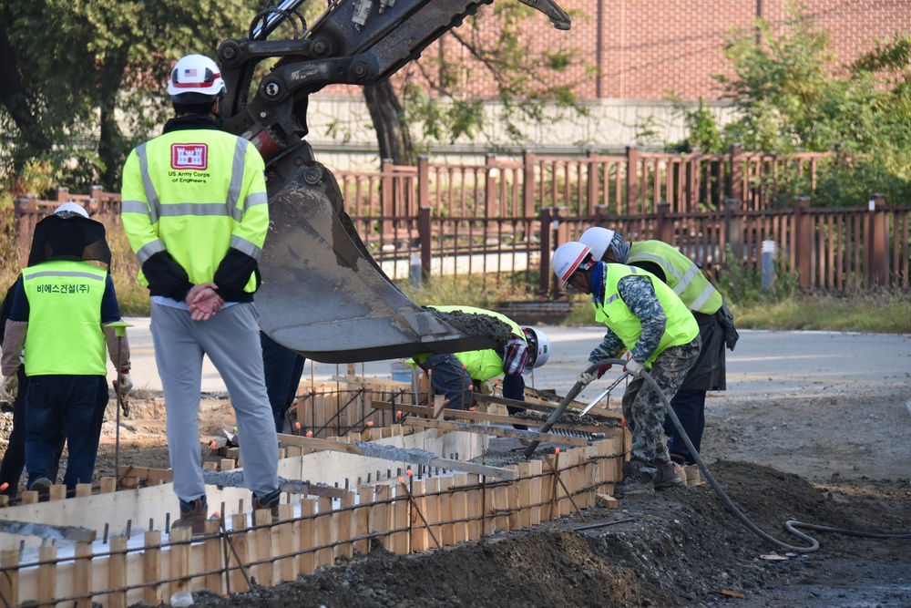 Army engineers place concrete for new roundabout on Camp Humphreys, South Korea