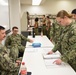 SCSTC Accession-Level Sailors Practice Hanging Danger Tags