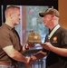 Sgt. Maj. Mooso gifts MG Dyer with Drill Sergeant Hat