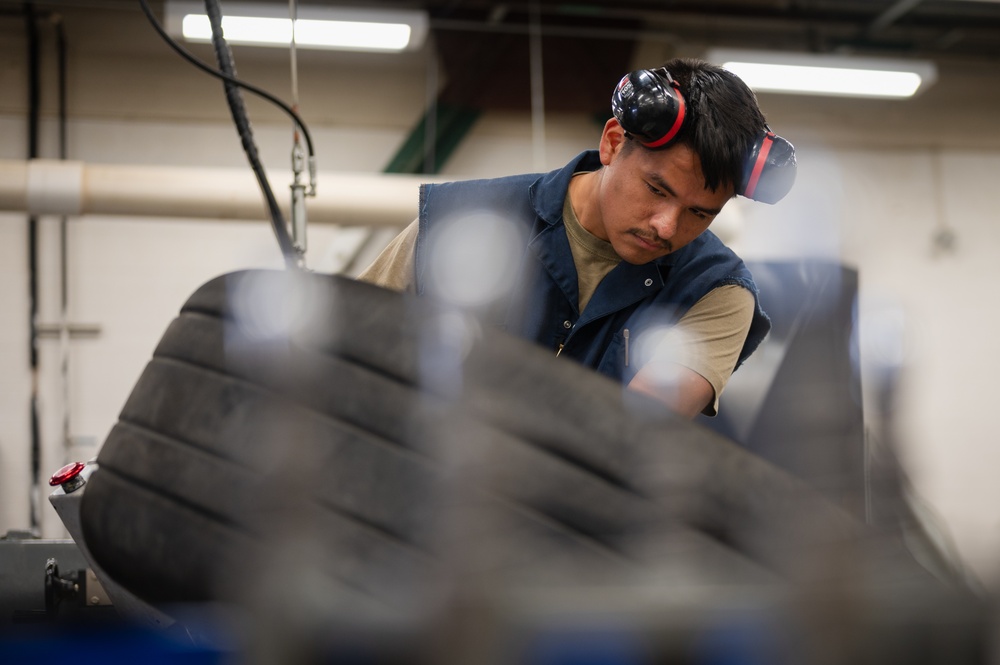 Whiteman wheel and tire technicians service landing gear for B-2 and T-38 aircraft