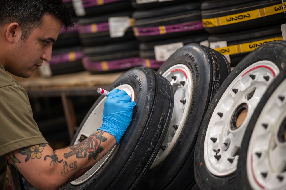 Whiteman wheel and tire technicians service landing gear for B-2 and T-38 aircraft