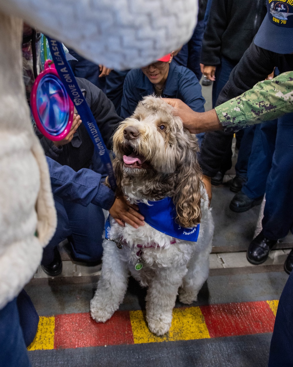 USS Ronald Reagan (CVN 76) welcomes therapy dogs from Love on a Leash