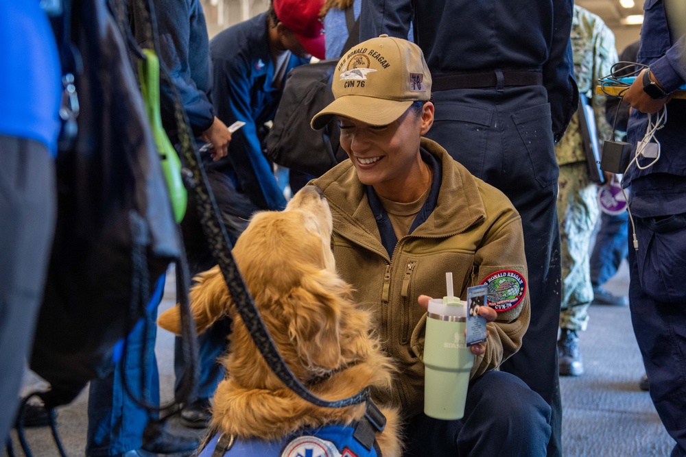 USS Ronald Reagan (CVN 76) welcomes therapy dogs from Love on a Leash