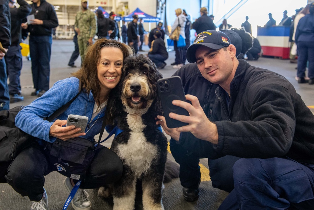 USS Ronald Reagan (CVN 76) welcomes therapy dogs from Love on a Leash