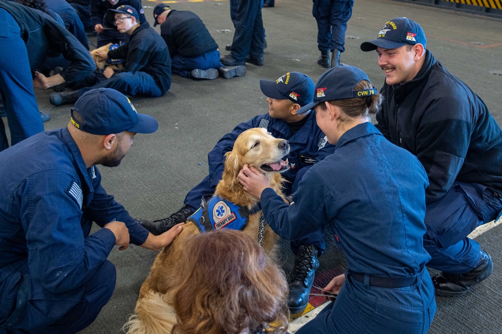 USS Ronald Reagan (CVN 76) welcomes therapy dogs from Love on a Leash