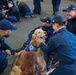 USS Ronald Reagan (CVN 76) welcomes therapy dogs from Love on a Leash