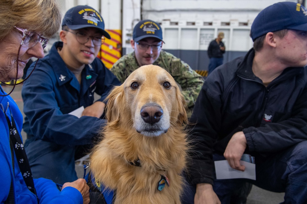 USS Ronald Reagan (CVN 76) welcomes therapy dogs from Love on a Leash