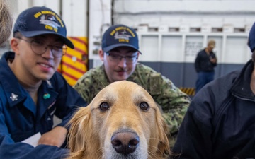 USS Ronald Reagan (CVN 76) welcomes therapy dogs from Love on a Leash