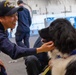 USS Ronald Reagan (CVN 76) welcomes therapy dogs from Love on a Leash