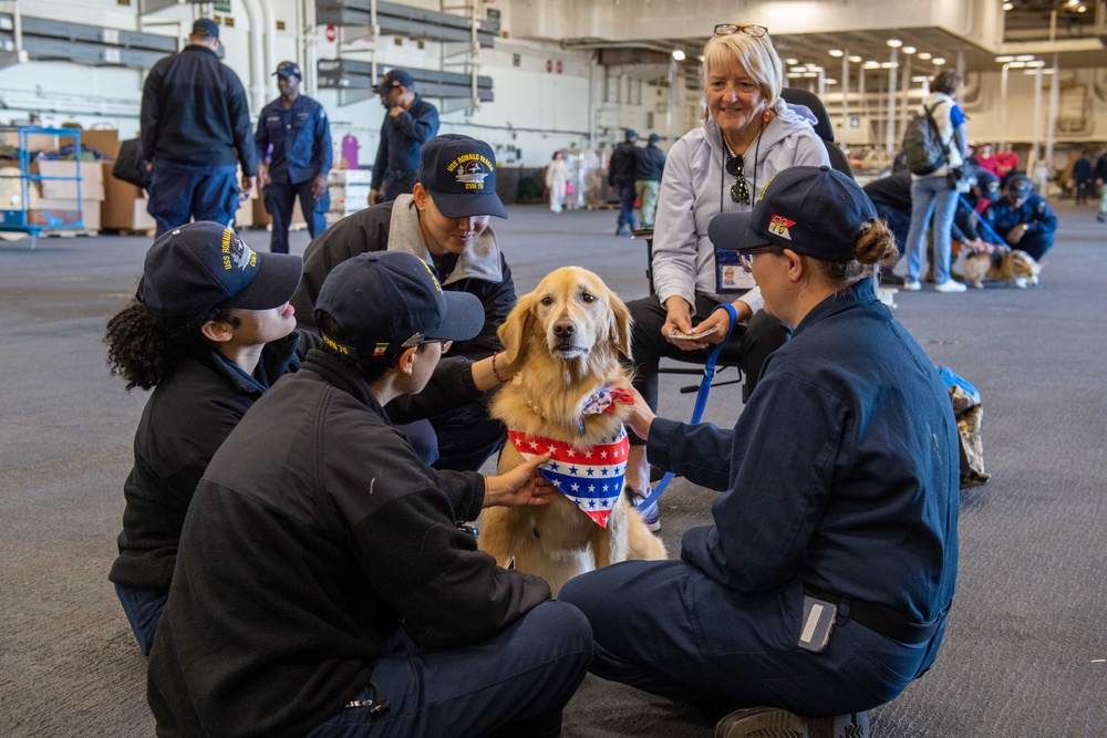 USS Ronald Reagan (CVN 76) welcomes therapy dogs from Love on a Leash