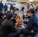 USS Ronald Reagan (CVN 76) welcomes therapy dogs from Love on a Leash