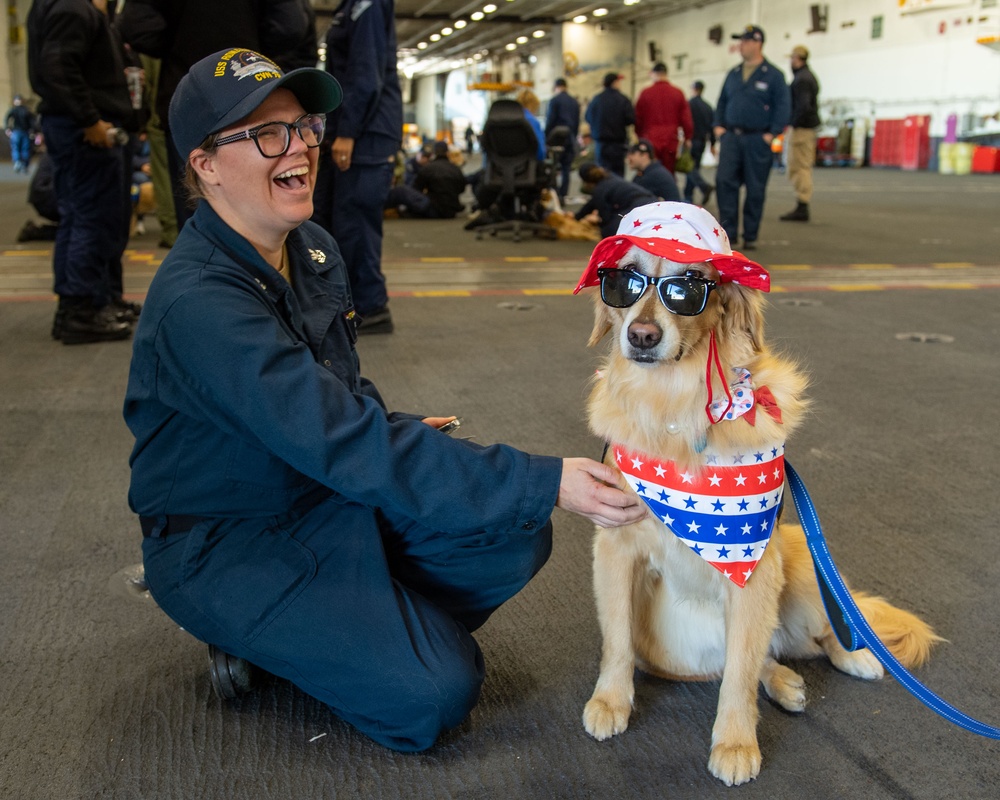 USS Ronald Reagan (CVN 76) welcomes therapy dogs from Love on a Leash