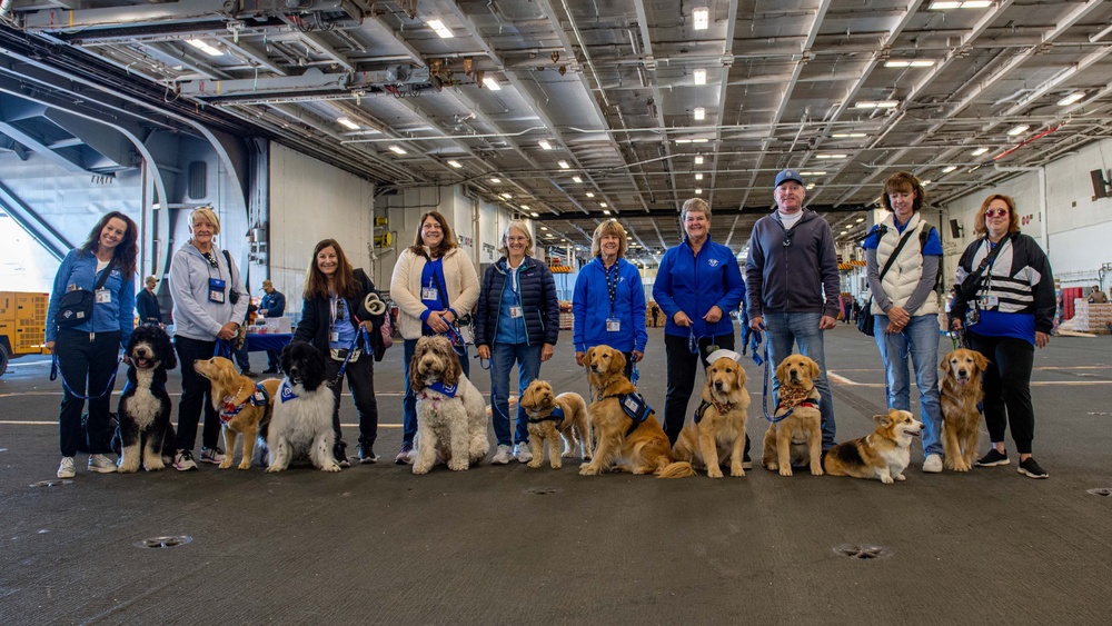 USS Ronald Reagan (CVN 76) welcomes therapy dogs from Love on a Leash